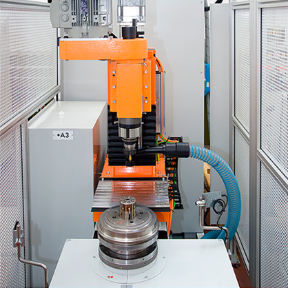Balancing machine with automatic drilling unit